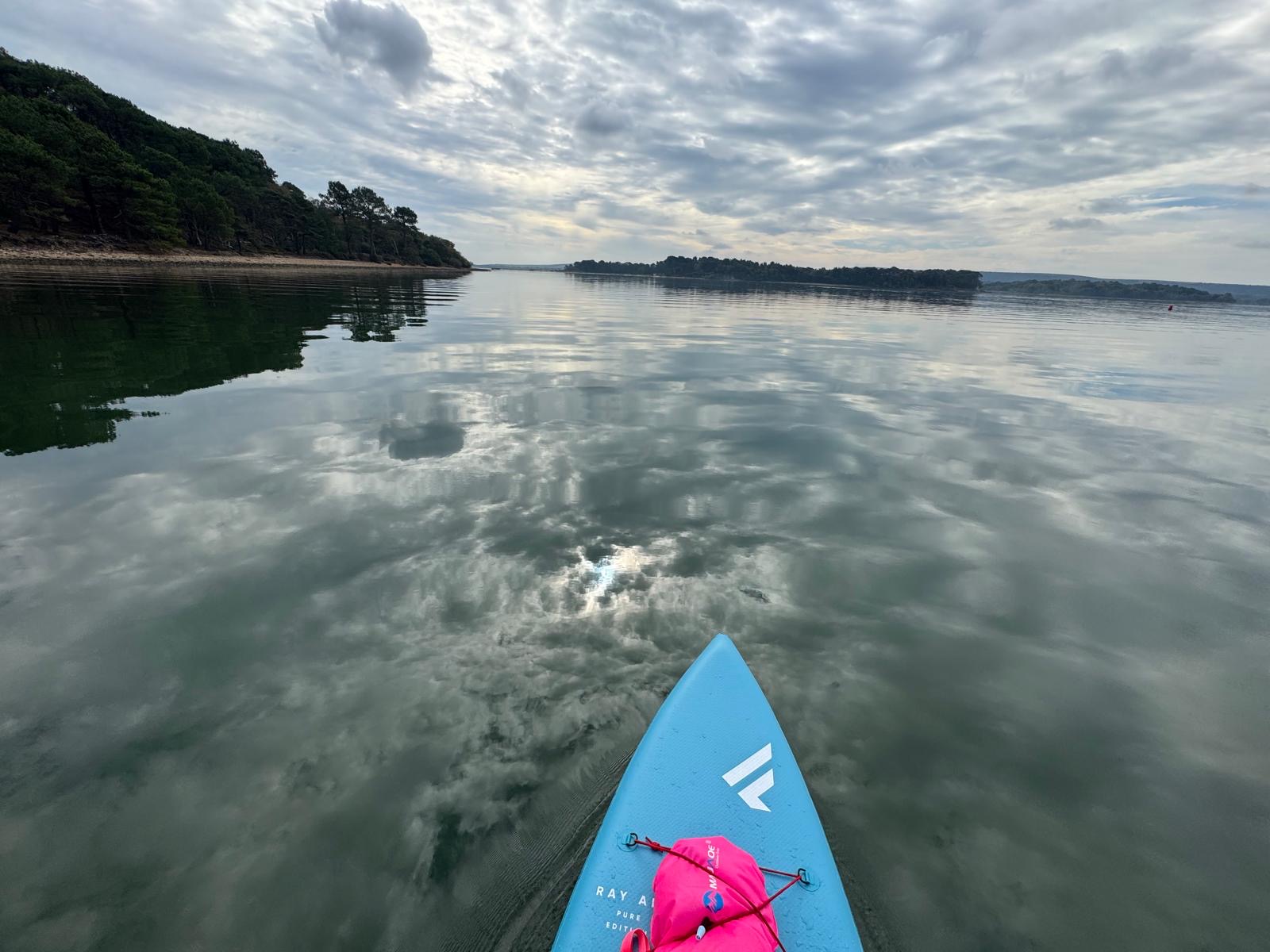 Calm water paddle boarding in the winter